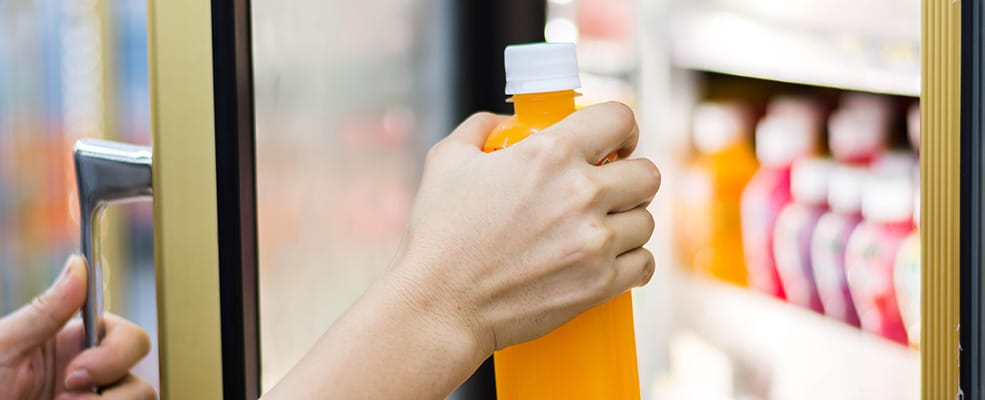 Puling Drink From Store Fridge | Orange Energizing Solutions