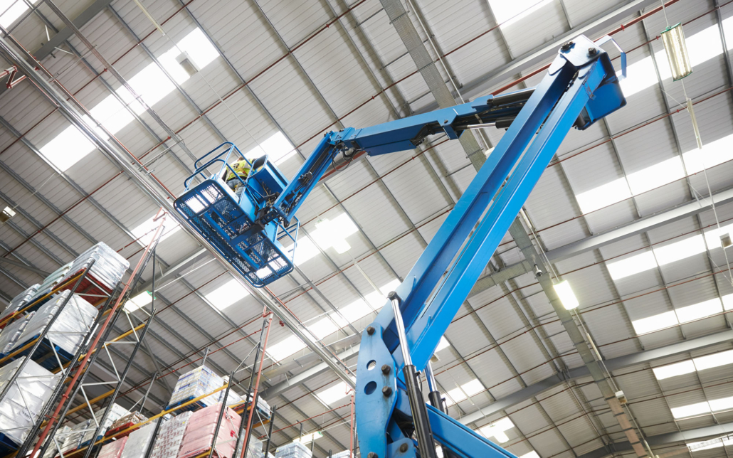 Worker On A Lift Installing Lighting