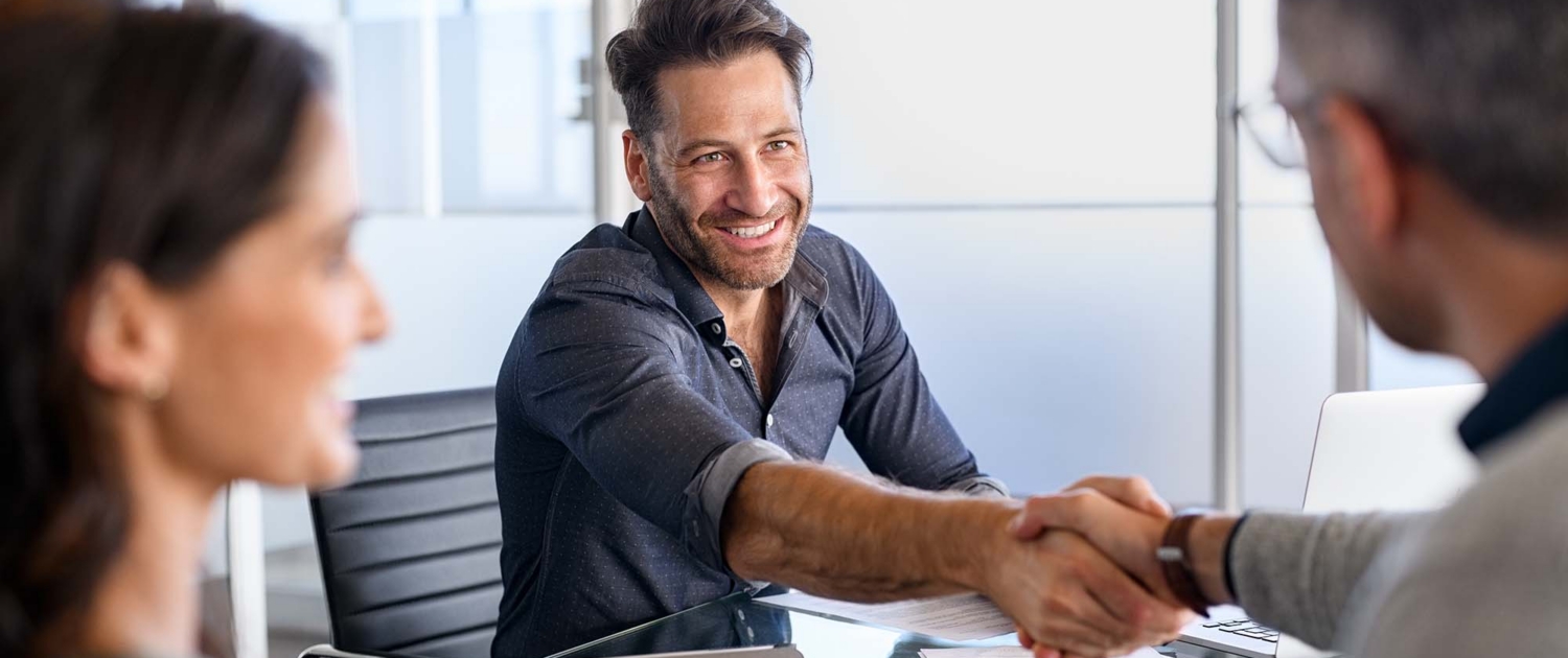 Business Meeting With Handshake