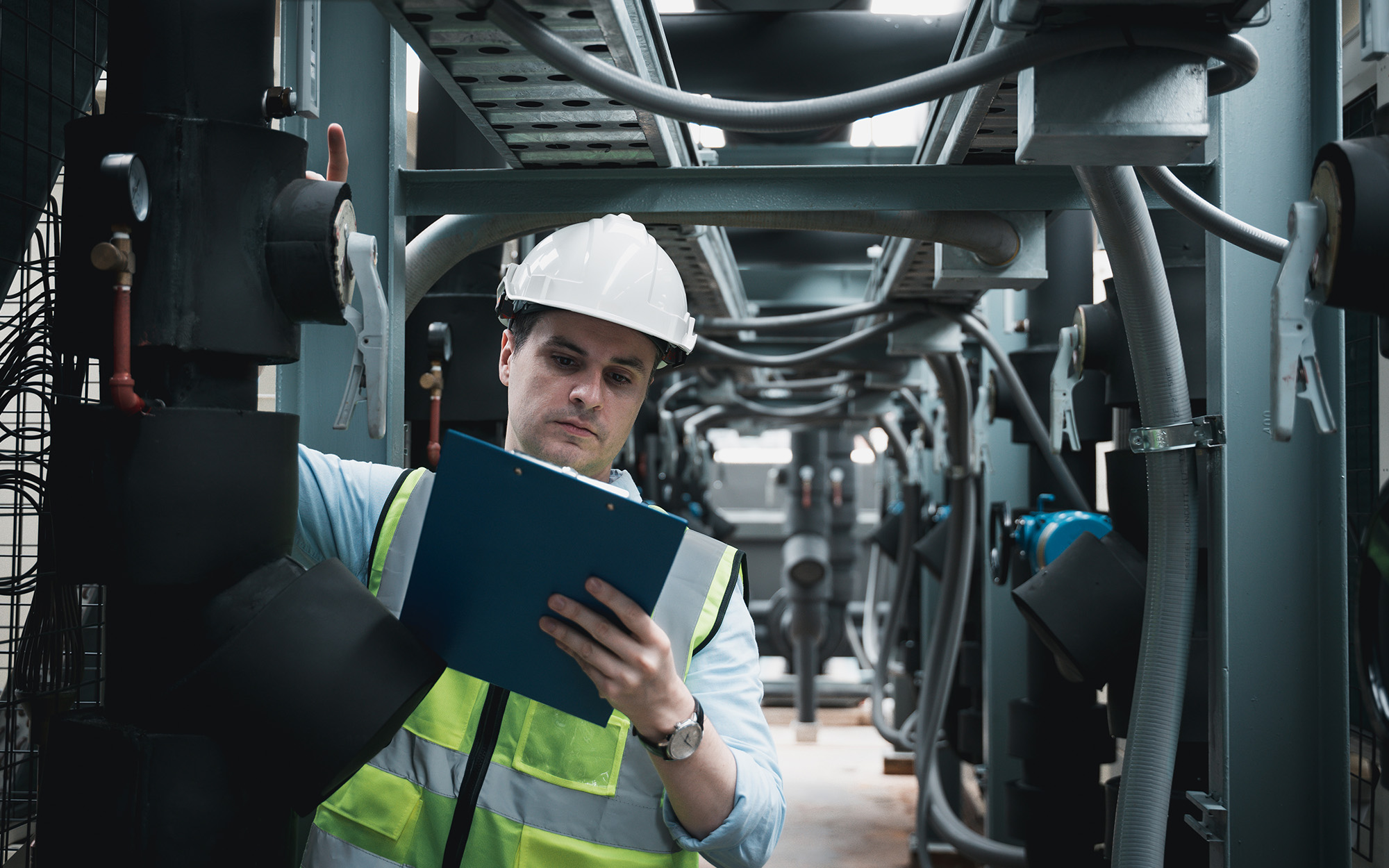 Engineers Are Inspecting A Large Building Or Industrial Facility's Cooling System